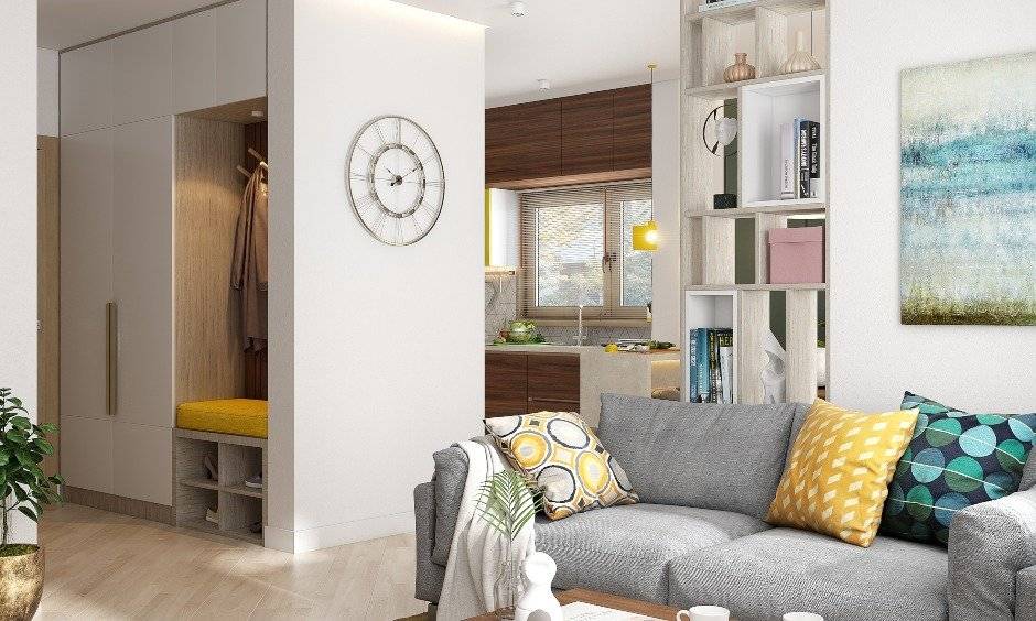 2bhk house interior design with floor to ceiling cabinets, a coat rack and tiny seating arrangement