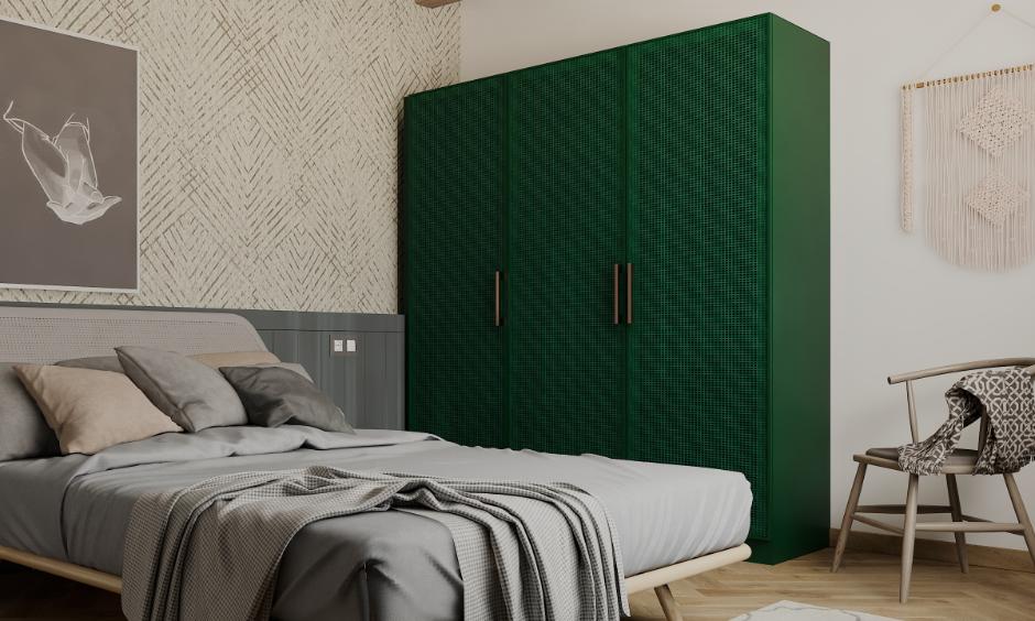 Contemporary bedroom with green steel wardrobe featuring sleek handles and textured doors