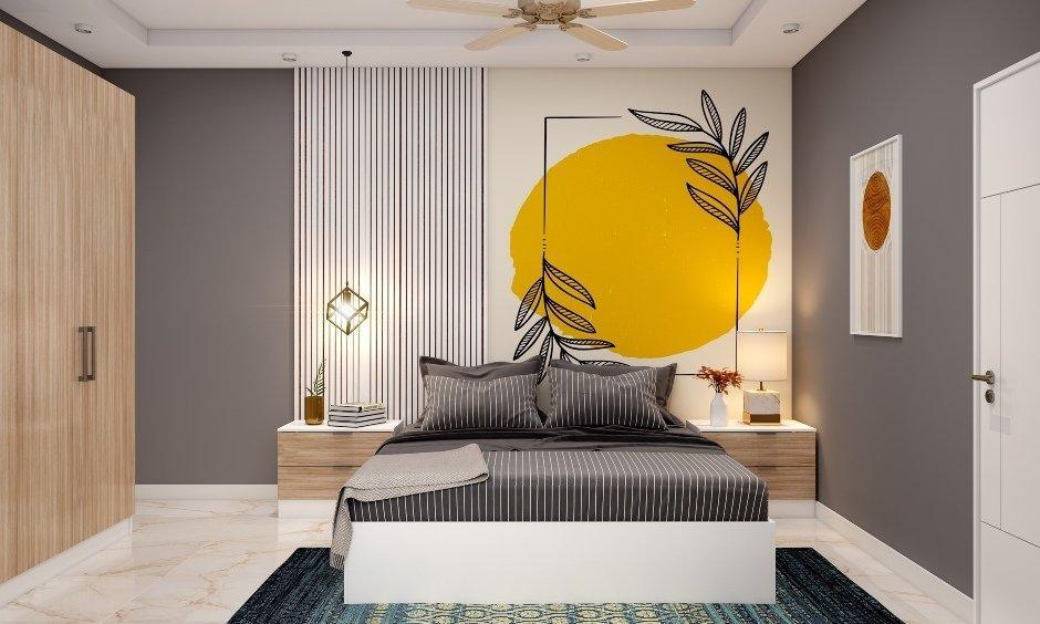 Bedroom with light grey walls, no mirror facing bed, bed aligned south for Vastu dosh.