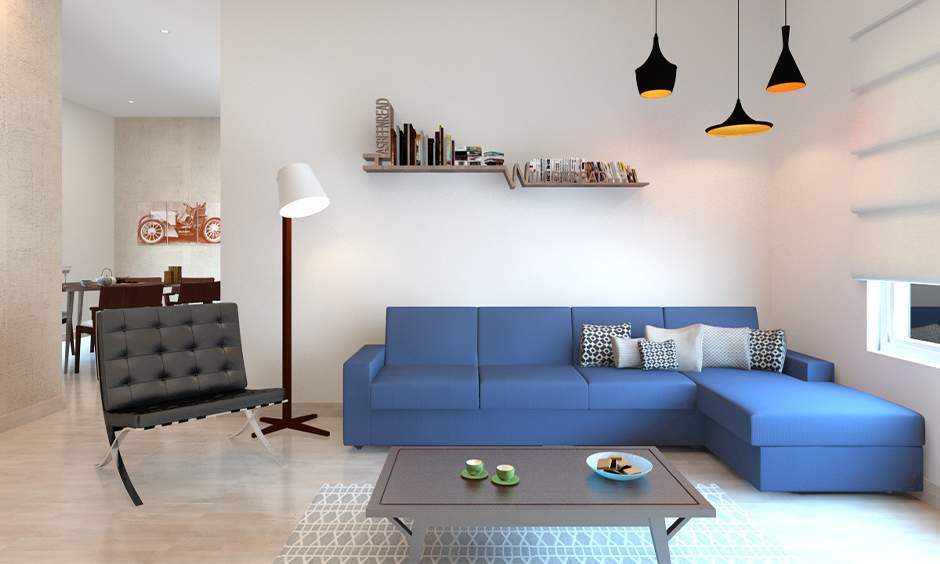 Blue sofa enhances decor with its vibrant hue, offering style and comfort in any living space
