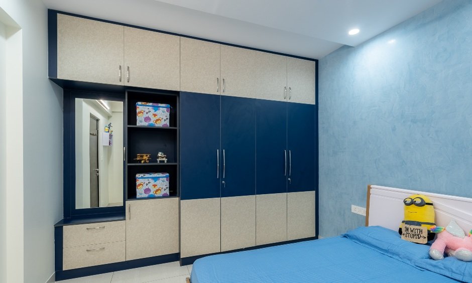 Blue toned kid's bedroom with modular wardrobe attached vanity unit set