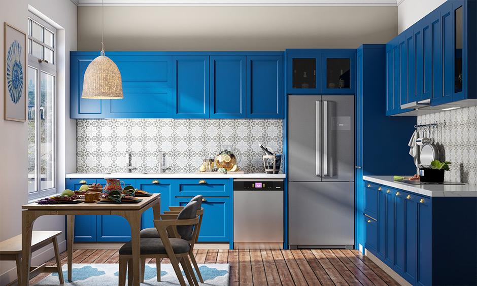 Bold blueshaker cabinets with patterned backsplash for a contemporary kitchen