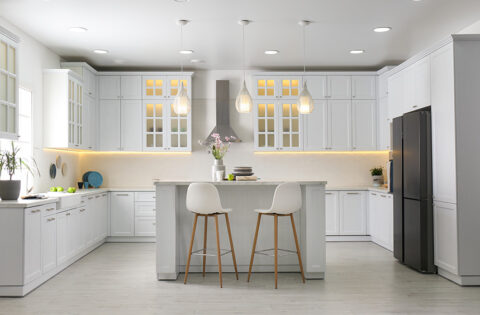 C-shaped kitchen design with ample counter space for cooking and dining.