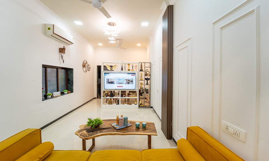 Stylish celebrity house interior: a narrow living room in white