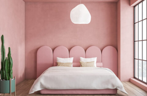 Modern home interior with baby pink walls, warm lighting, and stylish decor for a soft and welcoming look