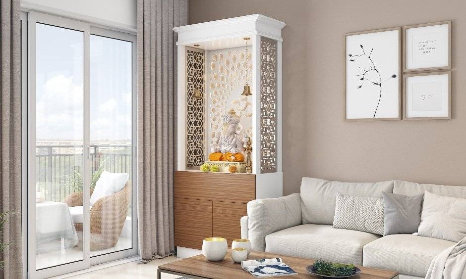 Corner pooja unit design with carved backdrop for a personalised touch