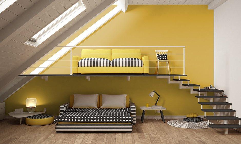 Attic-style bedroom with yellow wall, black and white theme, and wooden floor