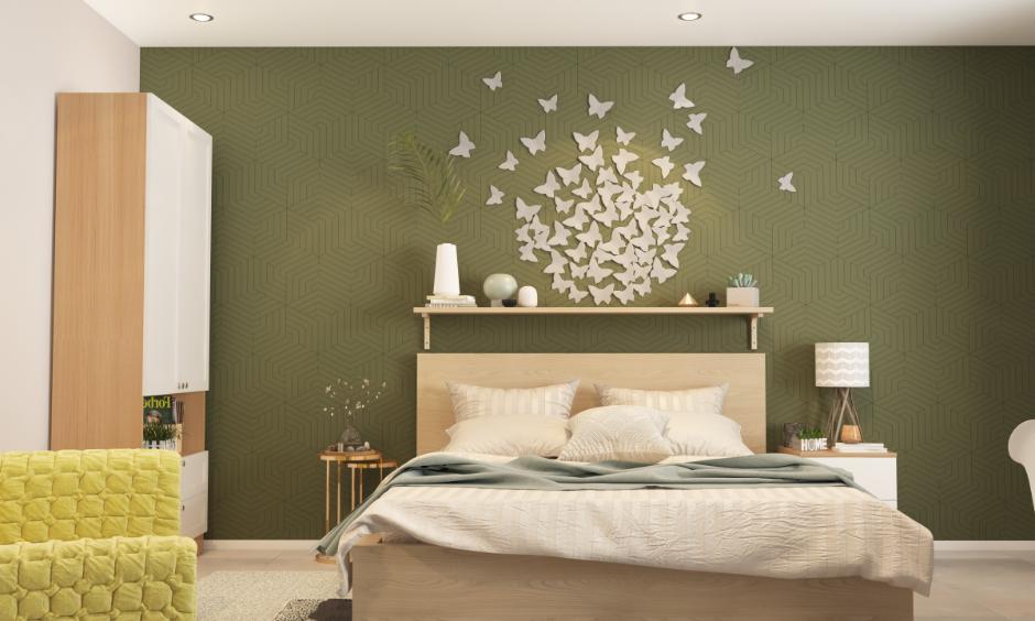 Dark green bedroom accent wall stencil design for a calmer effect