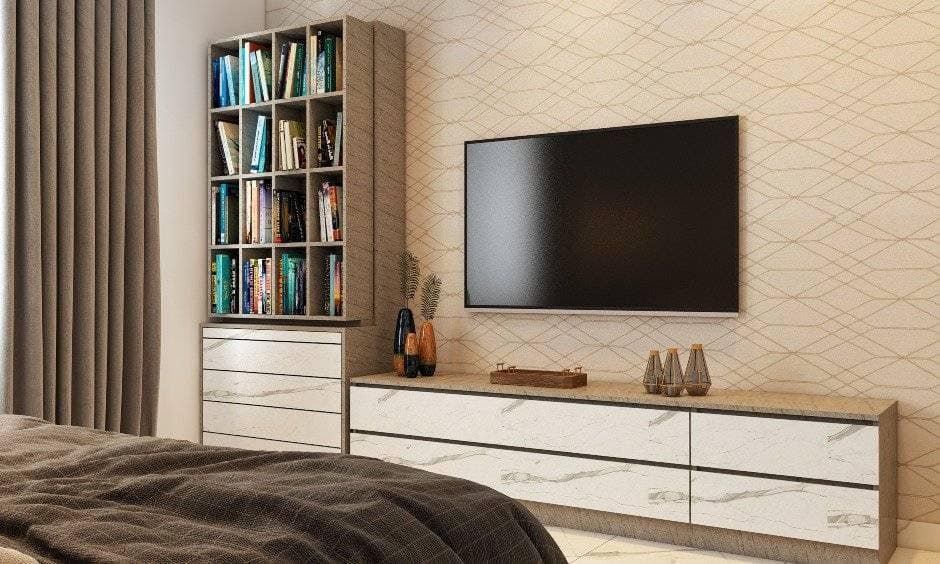 Elegant 1bhk house design with a tv unit and open shelf to display books
