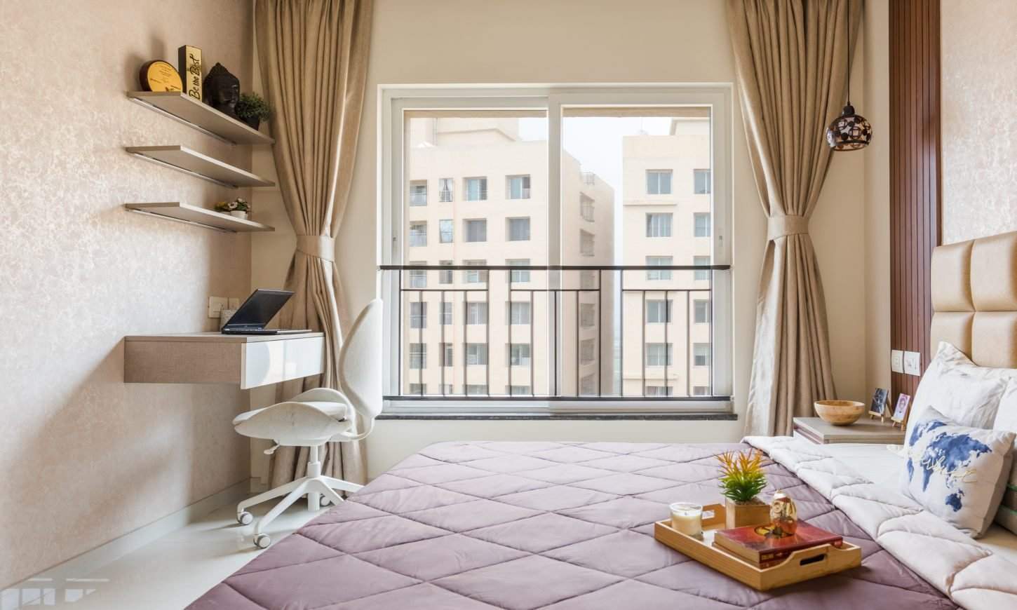 2 bhk apartment in Thane West features a guest bedroom with a corner study unit designed by designcafe