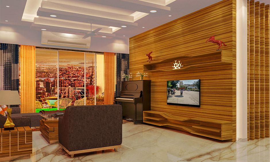 Living room with layered gypsum ceiling design featuring smooth curves and concealed lighting.