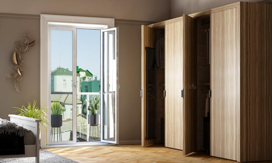 Modern bedroom wardrobe with sleek wooden finish doors, highlighting material choice between HDHMR sheet and plywood