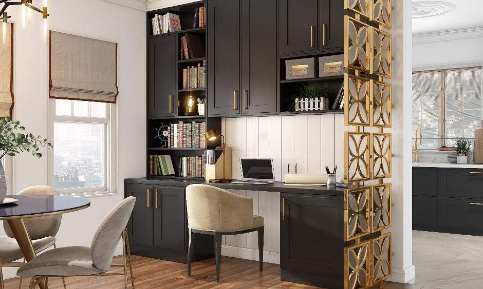 Home office design with an old-style wooden table and cabinet unit with bronze-gold handles and a barrel upholstered chair completes the office setup