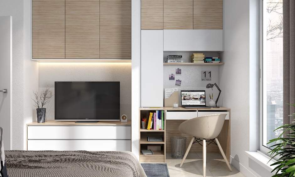 Home office interior design with a combination of shelves with two handleless drawers, a floating shelf and open cabinets and bucket chair