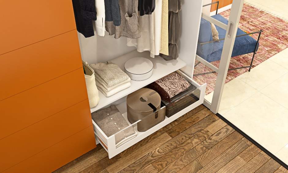 Home wardrobe design with wide compartment above to hang coats, shirts, and jackets
