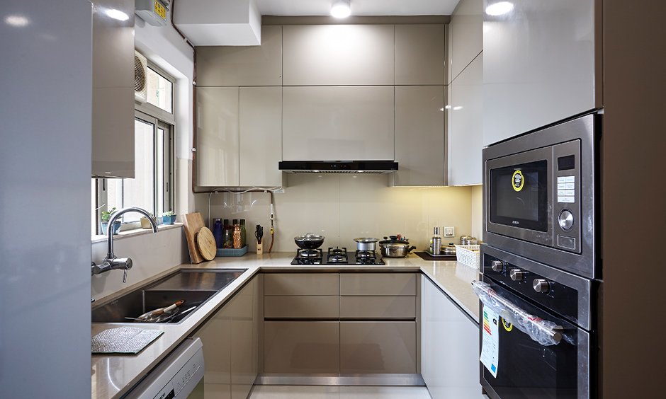 U shape kitchen with overhead cabinet designed by interior design contractors in mumbai