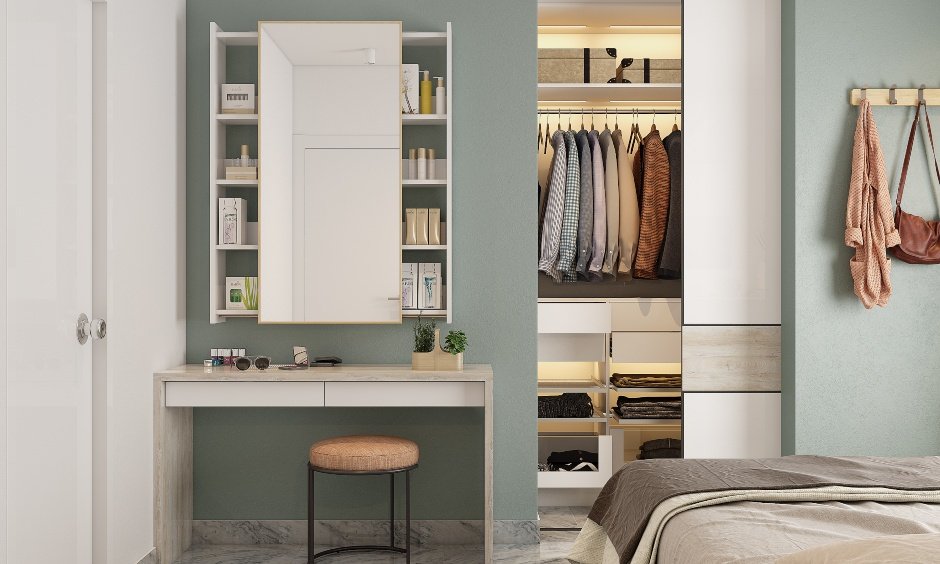 interior design of 2bhk with a side table, a dressing unit and a sliding door wardrobe in bedroom