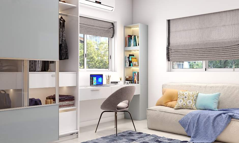 A kids study desk with drawers and a free-standing bookshelf to utilise the bedroom corner space