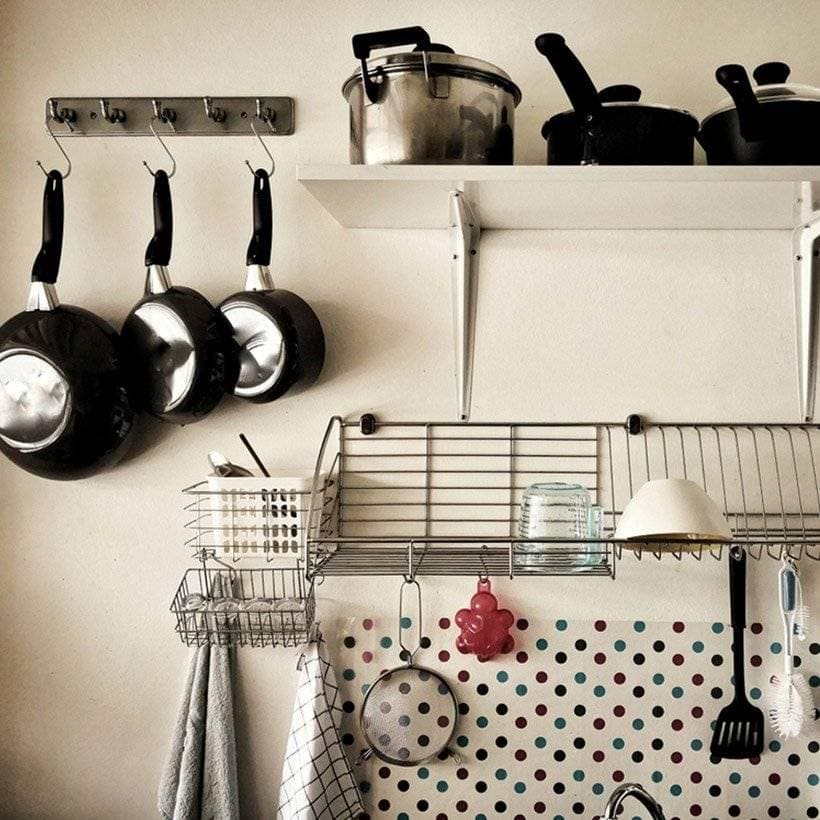 Hanging racks which tell you how to organise a kitchen with iron hanging which can hang utensils for kitchen organisation ideas