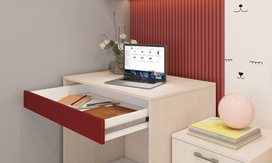 Lightwood laminate desk in the kids bedroom comprises a push-to-open drawer and a wall-mount cabinet