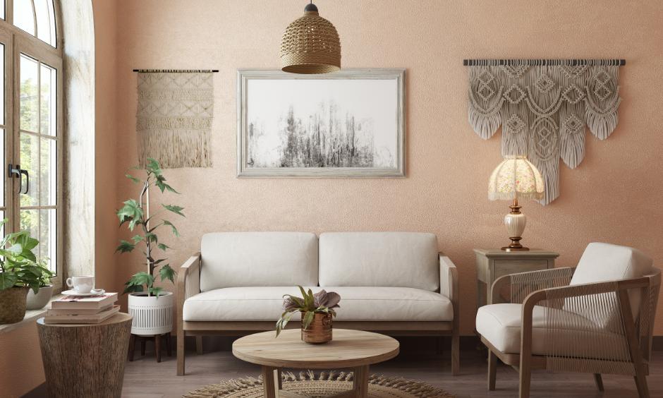 Minimalist bohemian living room blends earthy textures, soft peach walls, and wooden furniture for calm warmth.