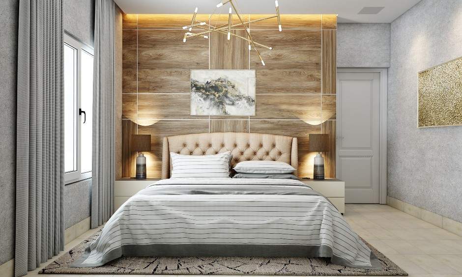 Modern bedroom has an accent wall designed in light wood laminate behind the bed