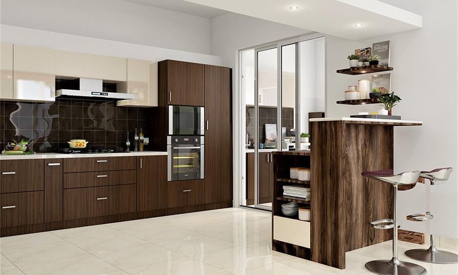 Sleek concealed sliding pantry door in a modern open-plan kitchen design