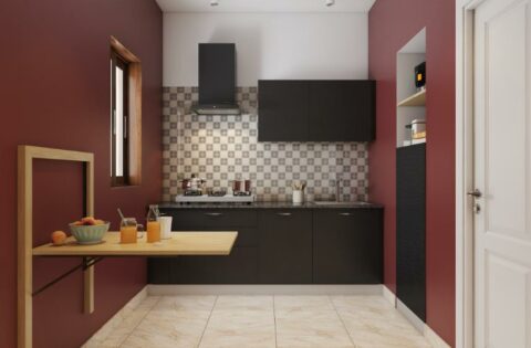 Normal kitchen design with black cabinets, wall-mounted foldable table and tiled backsplash