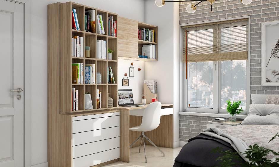 Small home office setup in the bedroom with a keypad pull out and a white chair