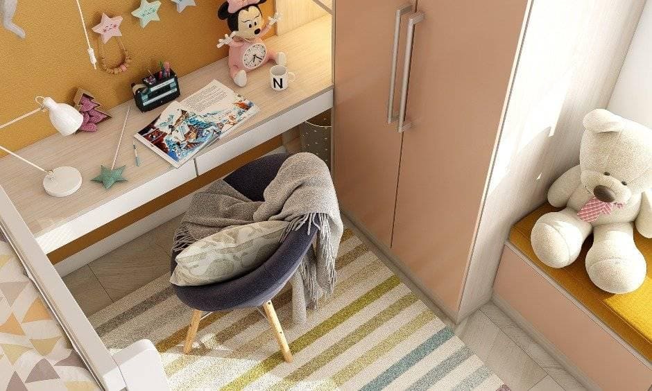 Study unit in 2bhk home designed with attached wardrobe in light pink