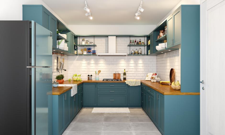 Jewel-toned teal shaker cabinets with wooden countertops for a beautiful look