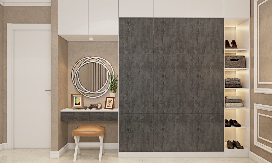 Three door wardrobe has multiple storages and an attached dress unit for a clutter-free organisation