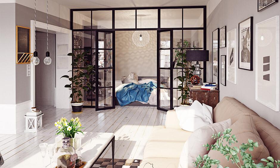 Dark-framed French bedroom doors with glass panels for stylish light-filled interiors