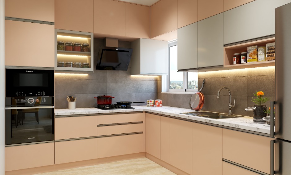 A u-shaped 1 bhk kitchen design comes with handless cabinets for a clutter-free look