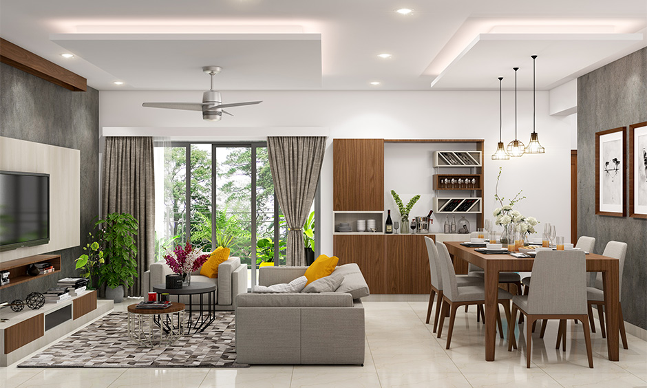 Contemporary false ceiling design with fan space for better airflow in hall.