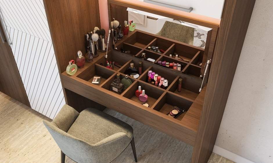 Wardrobe design with a dressing area finished in walnut wood is ideal for tiny Indian homes