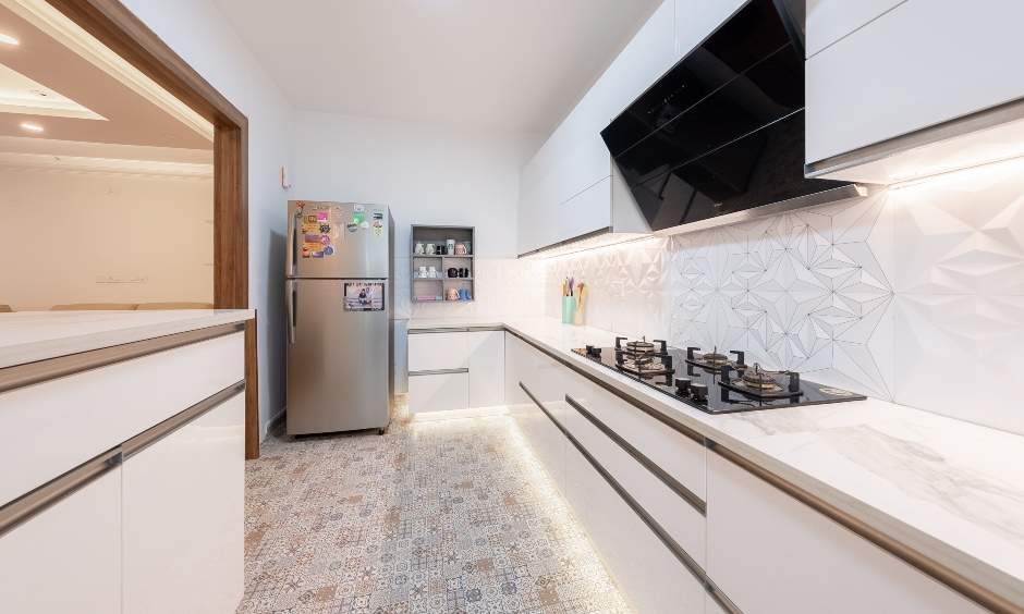 Modern open kitchen with white glossy laminate and breakfast counter in Bommanahalli, Bangalore