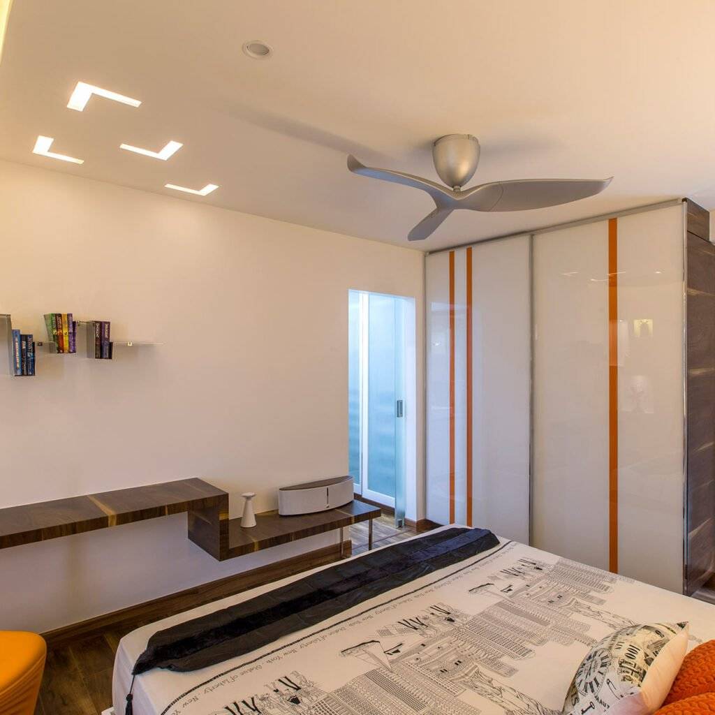 White sliding wardrobe doors add a modern touch with their pared back in wardrobe design slider