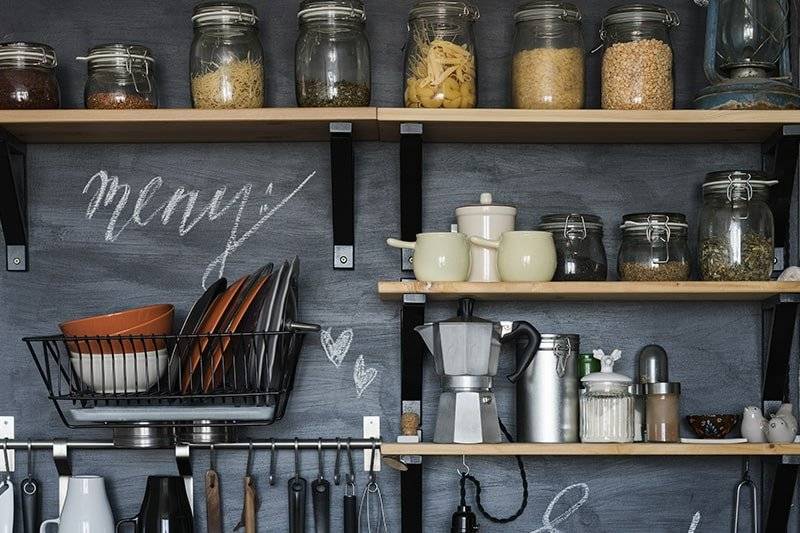 Kitchen wall shelves design with wooden shelves on black brackets with metal accents