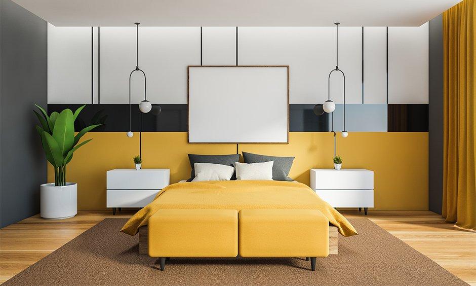 Yellow and brown bedroom with black divider and white accent details